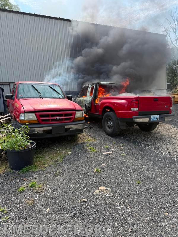 Two Autos On Fire Against the Building 7-26