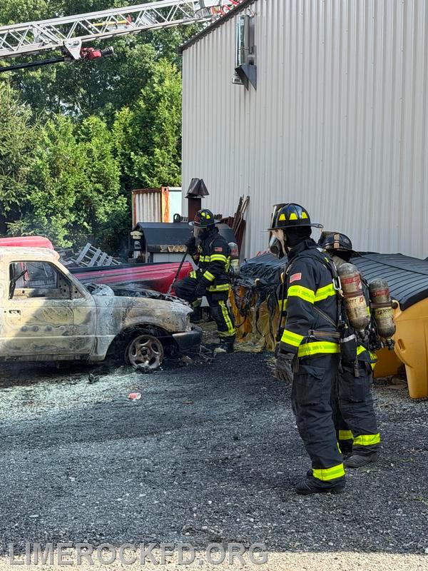 Two Autos On Fire Against the Building 7-26