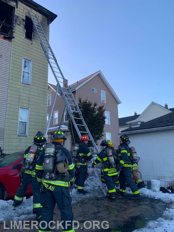 Engine 8 A Platoon assisting putting up a 40 ft Ladder on Second Ave Woonsocket